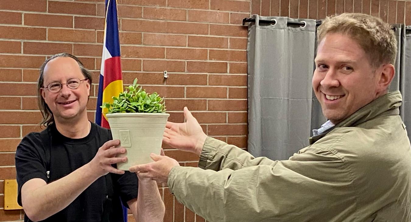 SMPA Communications Executive, Alex Shelley presents the Totally Green ‘Living Trophy’ to City of Ouray Mayor, Ethan Funk at the Ouray City Council Meeting, in January.